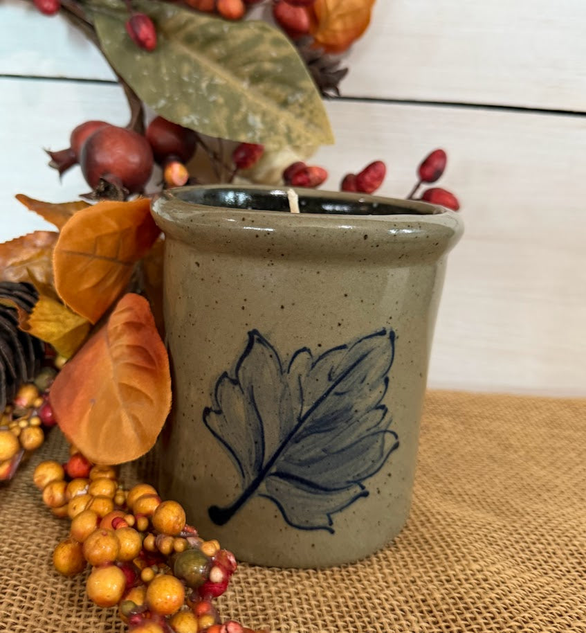 handcrafted 1 1/2 pint crock with a hand painted fall leaf in brushed cobalt paint photo'd with faux fall leaves