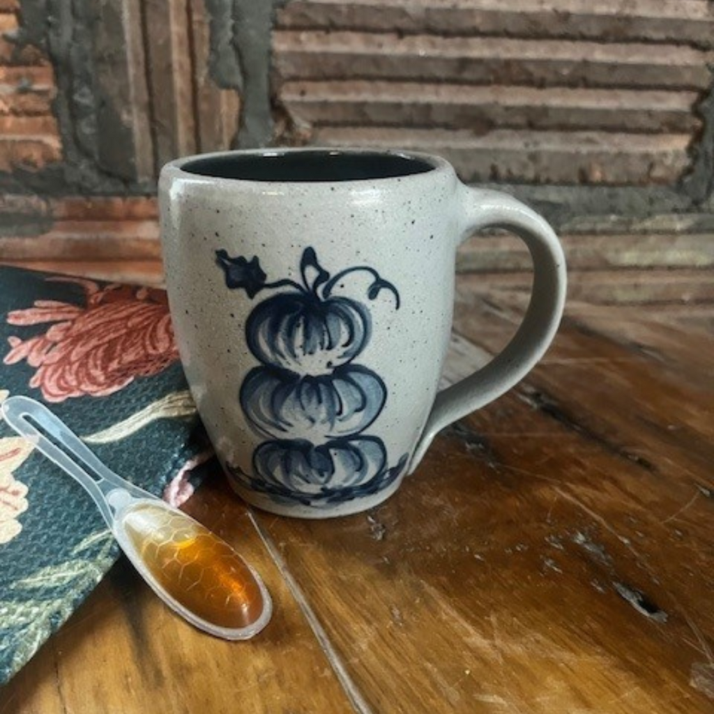 Rowe Pottery Hand thrown stoneware mug In a hand decorated Stacked Pumpkin pattern